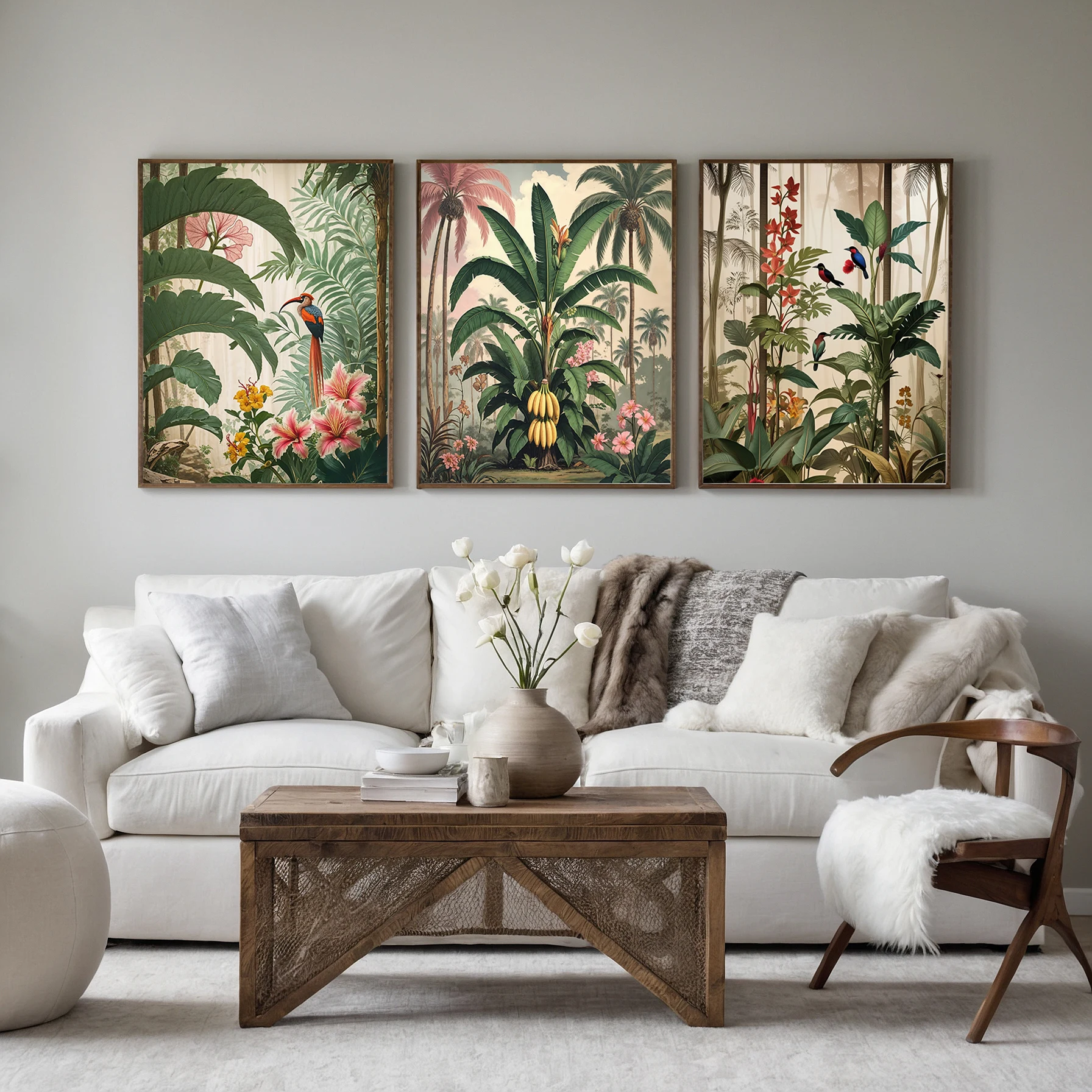 Three tropical jungle prints with birds, banana palms and flowers above a white living room sofa